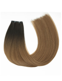 Gros plan sur la couleur châtain ambré B4/18 et la qualité Remy du tissage